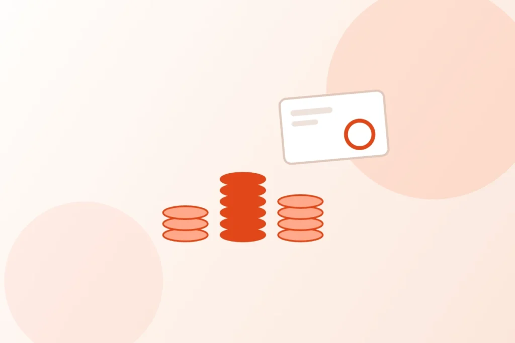 ベトナムで起業するときの費用のイメージ。高さの違う硬貨の山が3つと、支払いのカードが置かれている図。